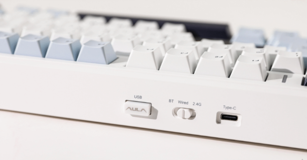Side view of AULA F99 Pro keyboard with adjustable RGB lighting.